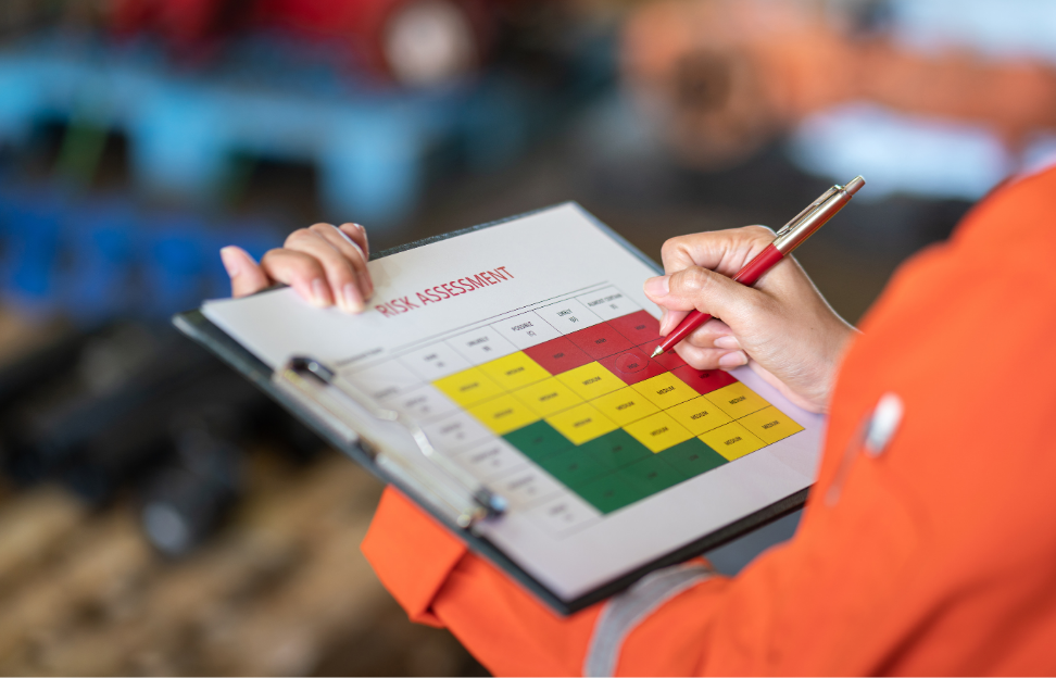 manager-is-using-ballpoint-pen-marking-risk-assessment-matrix-high-risk-level