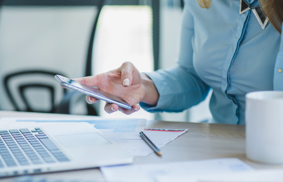 Businesswoman with smartphone close up