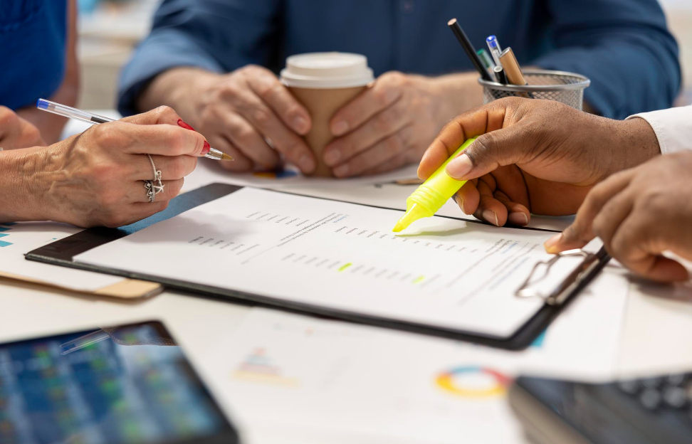 Financial planner expert highlighting contract terms for detailed retirement